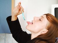 Red Haired Teen Babe Beth Nubiles Slowly Strips While Eating A Lollipop.