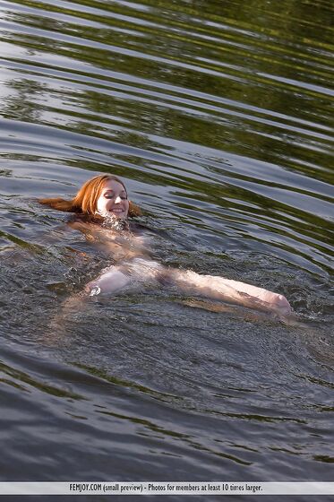 The Redhead Doll Vada Femjoy Is Bathing In The Cool River Water Absolutely Nude